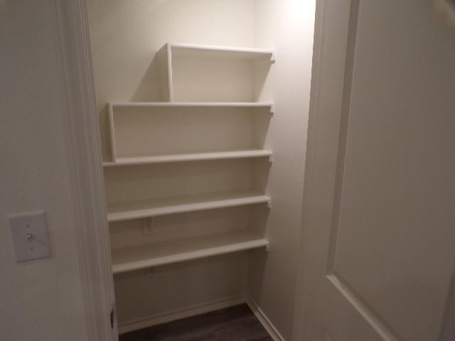 709 South 5th Street, Unit 1 Bonham, TX 75418 - Photo 11 of 32 a view of walk in closet with empty racks