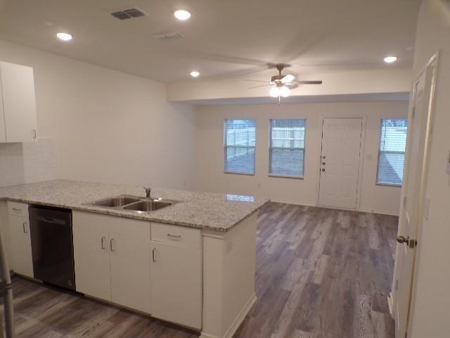 709 South 5th Street, Unit 1 Bonham, TX 75418 - Photo 30 of 32 a kitchen with a sink and chandelier