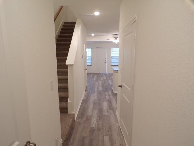 709 South 5th Street, Unit 1 Bonham, TX 75418 - Photo 8 of 32 a view of a hallway with wooden floor and staircase