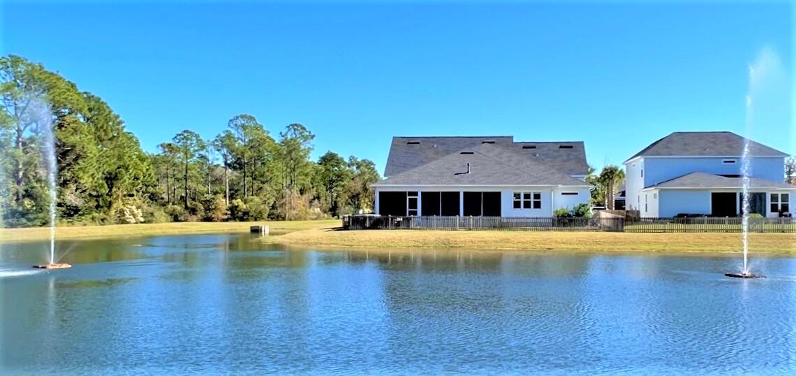 23 Bailey Avenue Santa Rosa Beach, FL 32459 - Photo 54 of 72 23 BAILEY REAR POND & HOUSE FROM STREET