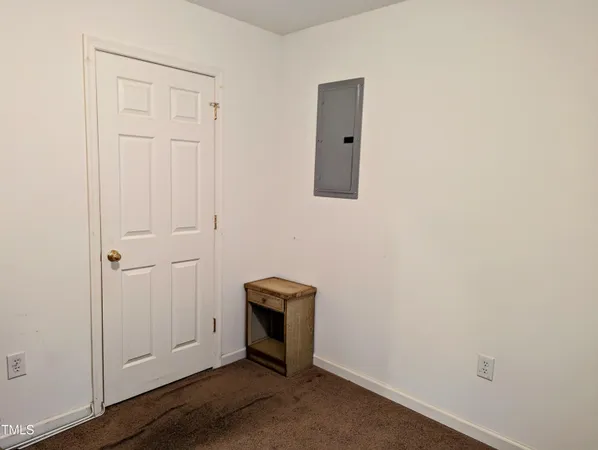 an empty room with wooden floor
