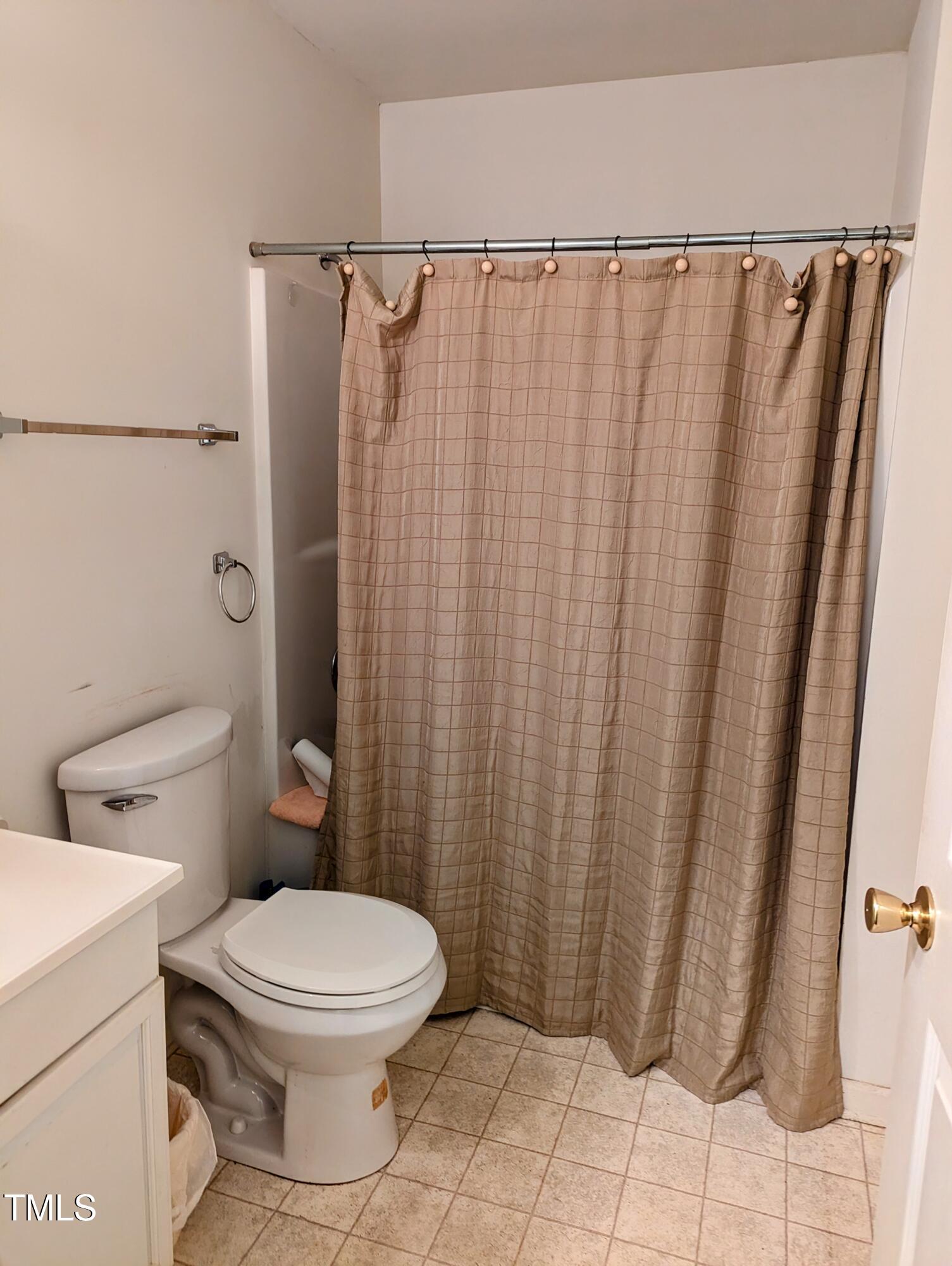 400 Skipwith Road Boydton, VA 23917 - Photo 5 of 10 a bathroom with a toilet and a shower curtain