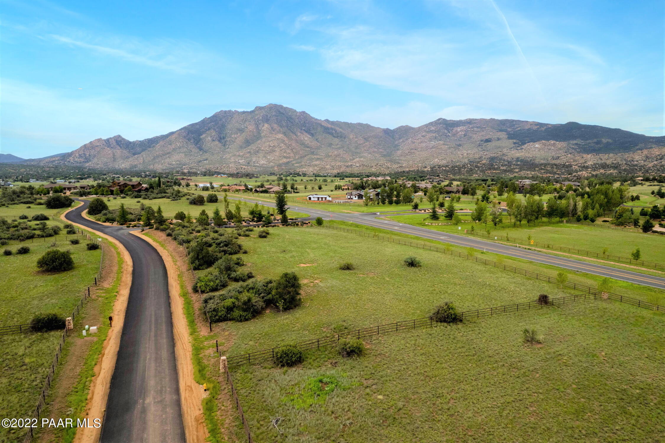 9630 North Equine Road Prescott, AZ 86305 - Photo 9 of 28 a view of a lush green hillside and a houses