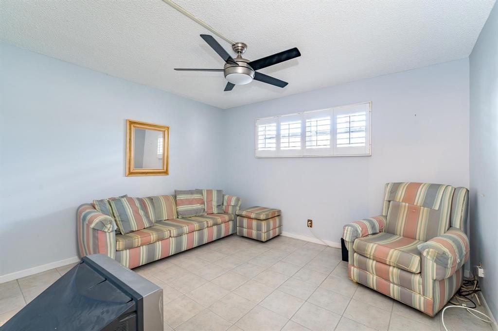 9500 North Hollybrook Lake Drive, Unit 109 Pembroke Pines, FL 33025 - Photo 11 of 57 a living room with furniture