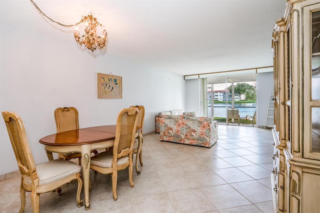 9500 North Hollybrook Lake Drive, Unit 109 Pembroke Pines, FL 33025 - Photo 13 of 57 a living room with furniture and a large window
