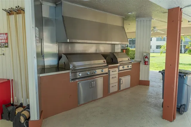 a kitchen with a stove and a refrigerator