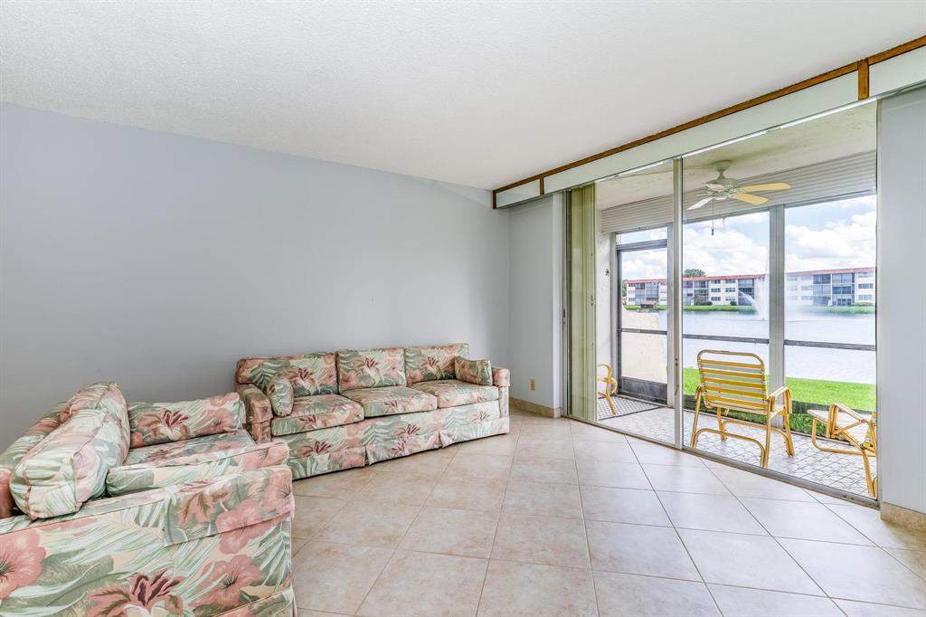 9500 North Hollybrook Lake Drive, Unit 109 Pembroke Pines, FL 33025 - Photo 15 of 57 a living room with furniture and a large window