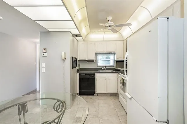 a view of a park with large trees