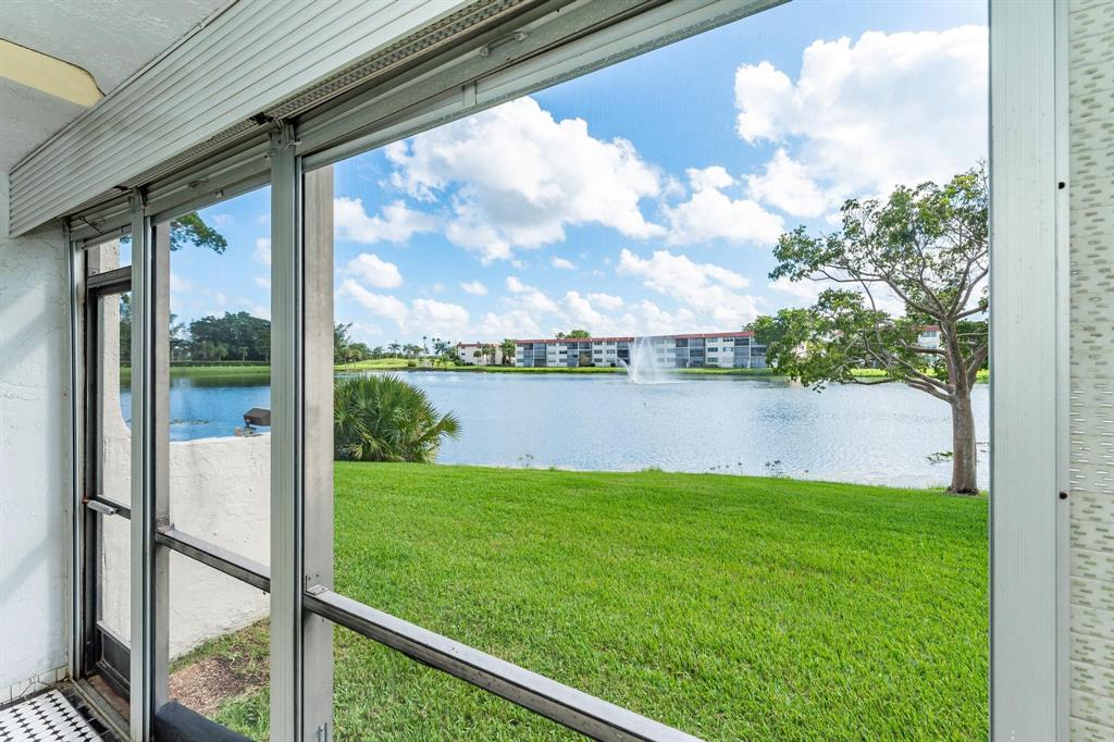 9500 North Hollybrook Lake Drive, Unit 109 Pembroke Pines, FL 33025 - Photo 5 of 57 a view of a chair and table in the balcony
