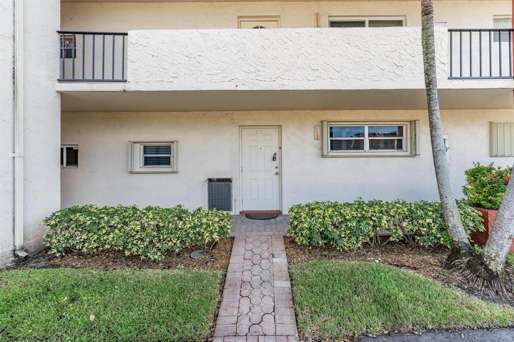 9500 North Hollybrook Lake Drive, Unit 109 Pembroke Pines, FL 33025 - Photo 7 of 57 a front view of a house with garden