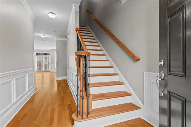 a view of staircase with wooden floor and staircase