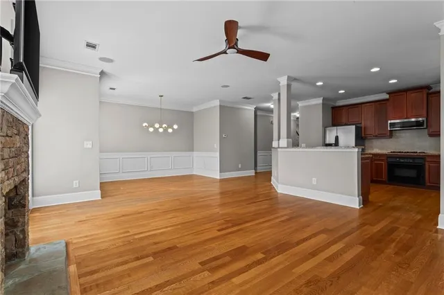 a view of a kitchen with microwave and cabinets