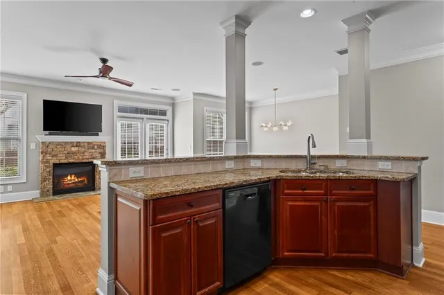 a kitchen with a sink and a fireplace