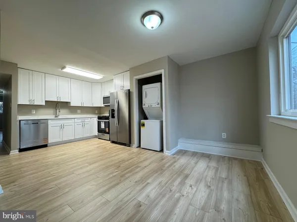 a view of kitchen with wooden floor