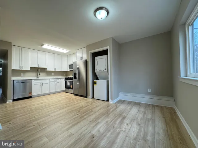 a view of kitchen with wooden floor
