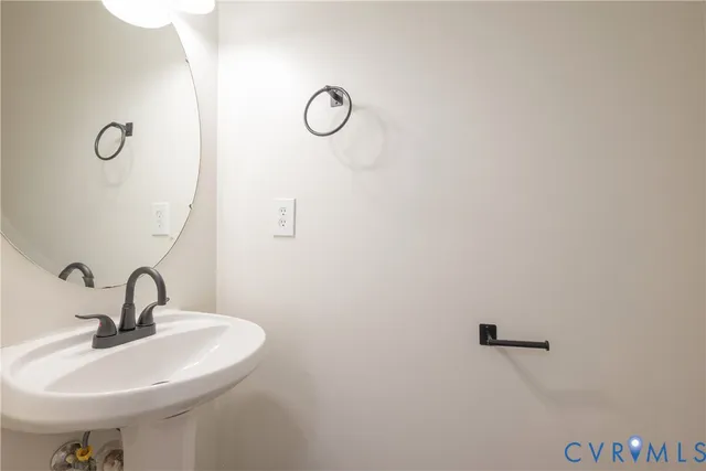 a bathroom with a sink and mirror