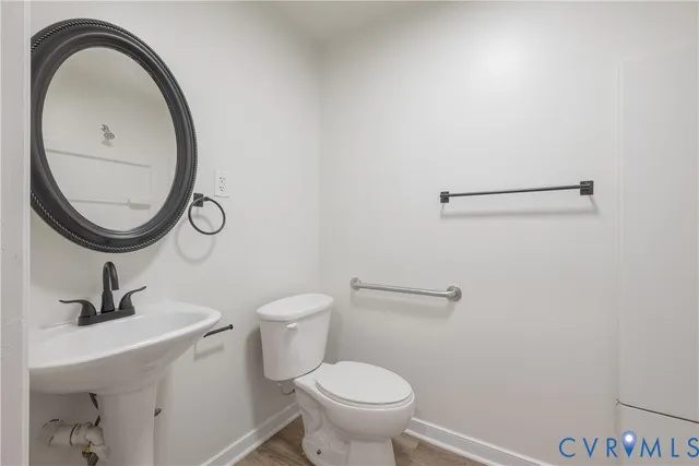 a bathroom with a glass shower door
