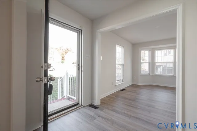 a view of entryway with wooden floor