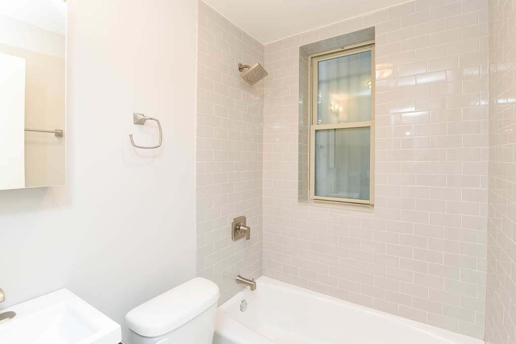 640 West Wrightwood Avenue, Unit 106 Chicago, IL 60614 - Photo 12 of 15 a bathroom with a toilet a sink and shower