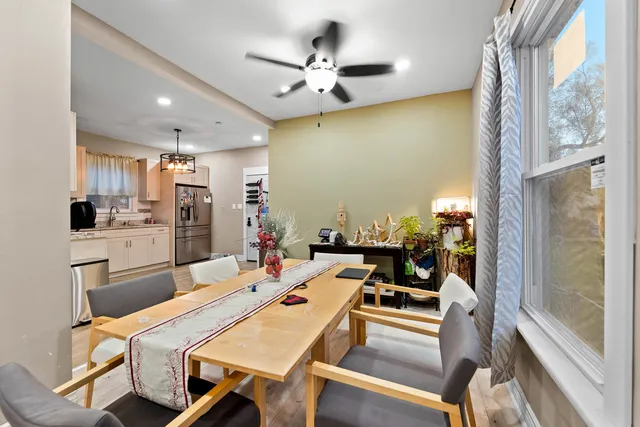a very nice looking dining room with a table and chairs