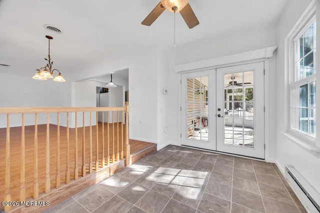 a view of an entryway with wooden floor
