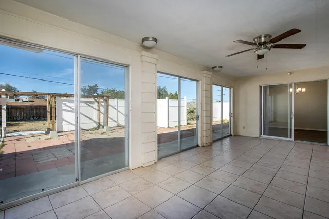 a view of a livingroom with an empty space and a window