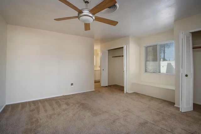 an empty room with fan