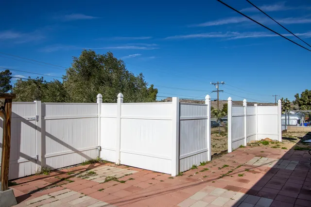 a view of a house with a snow in the yard