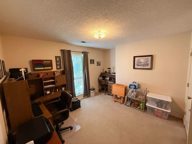 a view of house with yard