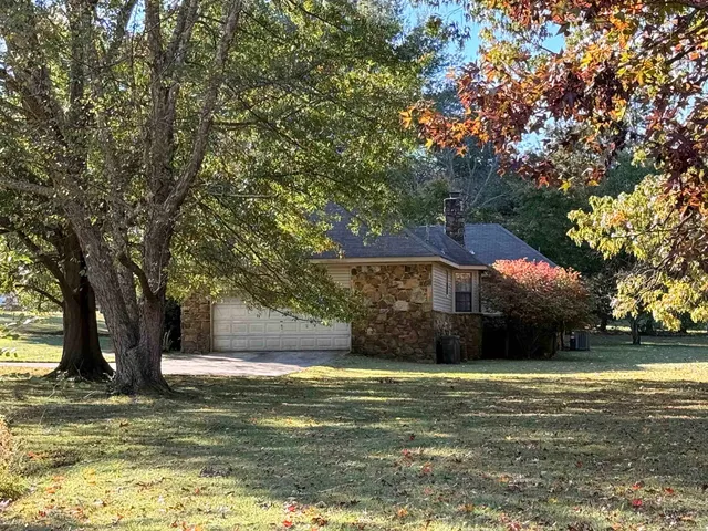 a view of a house with a garden