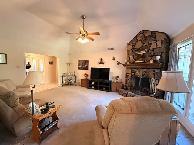 a living room with furniture and a fireplace