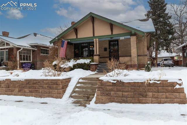 a lobby with furniture and floor to ceiling window