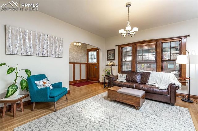 a living room with furniture and a table
