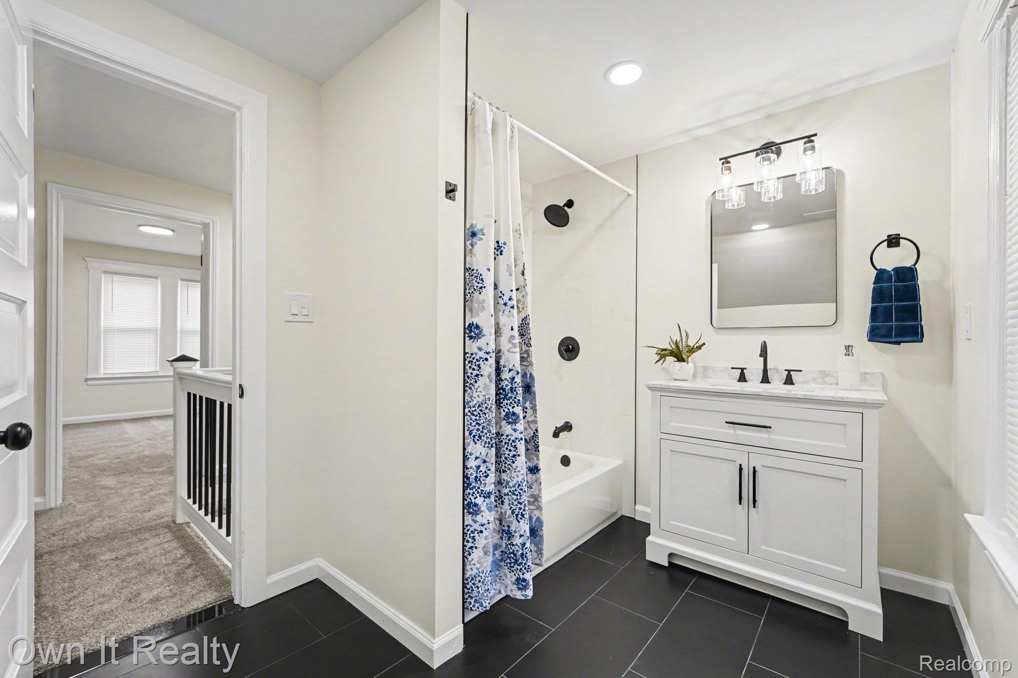168 Kerby Road Grosse Pointe, MI 48236 - Photo 24 of 36 Bathroom with vanity, shower / bath combo with shower curtain, dark tile patterned flooring, and recessed lighting