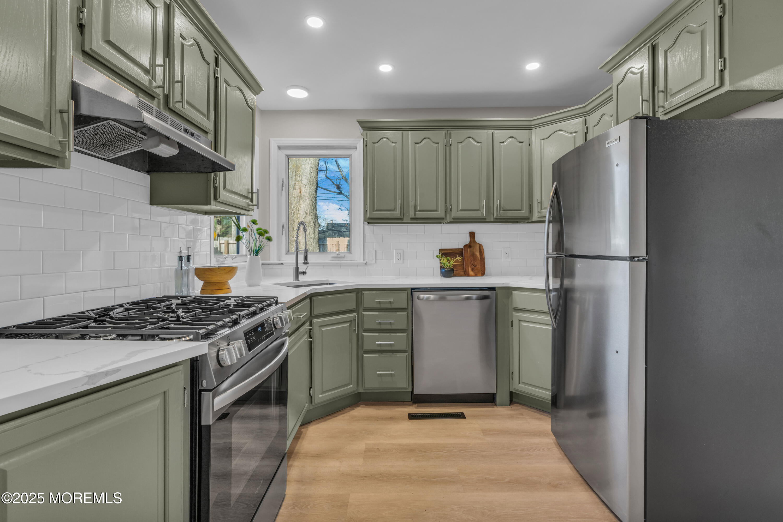 679 Mantoloking Road Brick, NJ 08723 - Photo 6 of 16 a kitchen with stainless steel appliances granite countertop a sink stove and refrigerator