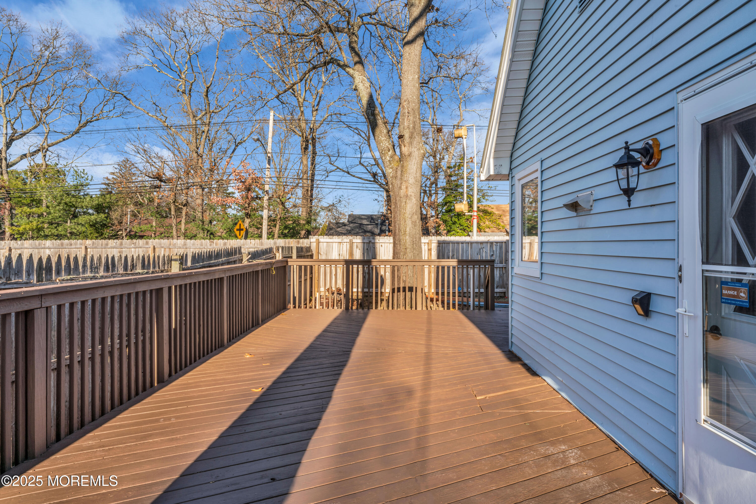 679 Mantoloking Road Brick, NJ 08723 - Photo 10 of 16 a view of balcony with wooden floor and fence