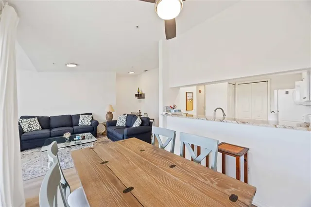 a living room with furniture and a mirror