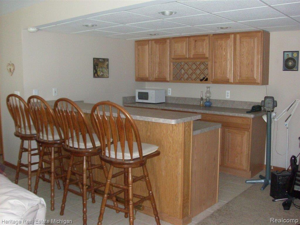 6348 Oak Grove Road Howell, MI 48855 - Photo 12 of 24 Farmily Room Snack Bar & Wet Bar