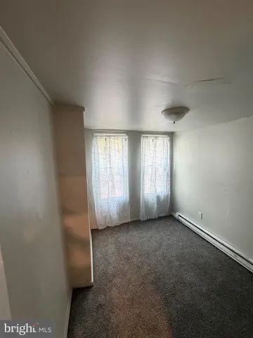 a large kitchen with stainless steel appliances a large counter top and a stove