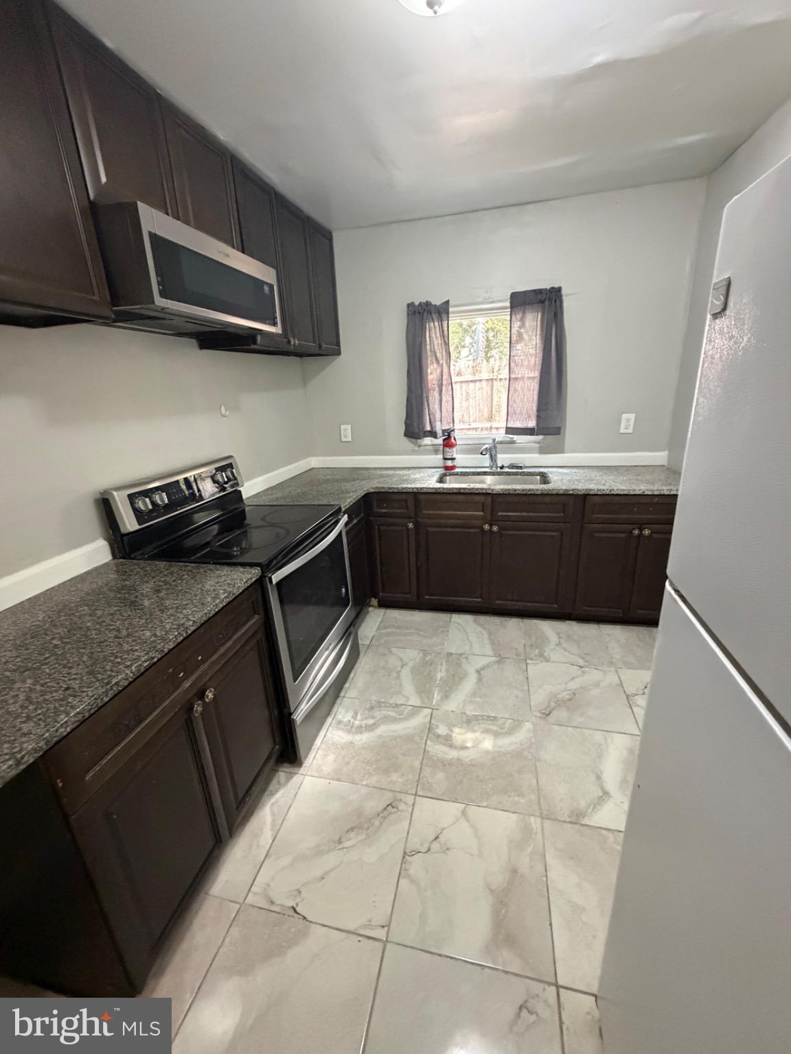 1609 Fillmore Street Philadelphia, PA 19124 - Photo 15 of 17 Modern kitchen with sleek finishes.