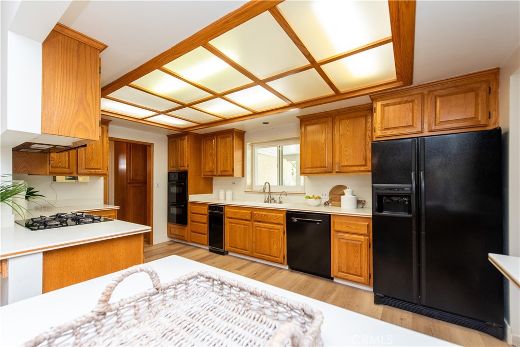 1112 Steele Drive Brea, CA 92821 - Photo 11 of 34 a kitchen with stainless steel appliances granite countertop a refrigerator and a stove top oven