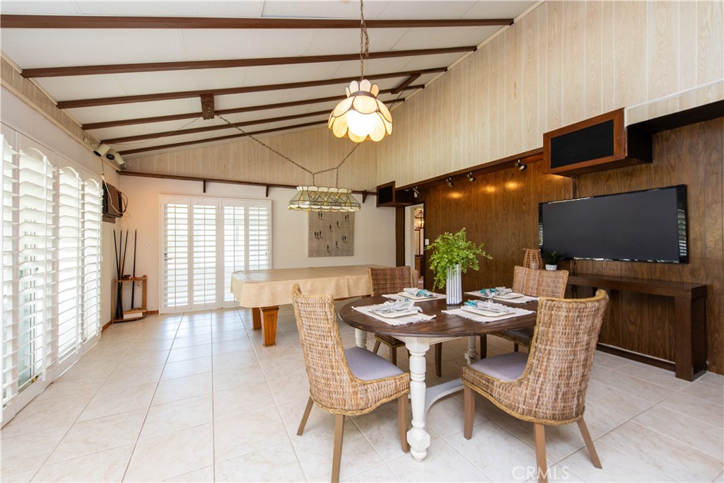 1112 Steele Drive Brea, CA 92821 - Photo 15 of 34 a dining room with furniture a flat screen tv and a large window