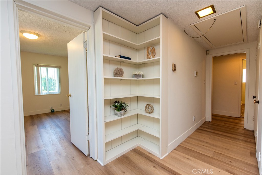 1112 Steele Drive Brea, CA 92821 - Photo 16 of 34 a view of a hallway with wooden floor and closet