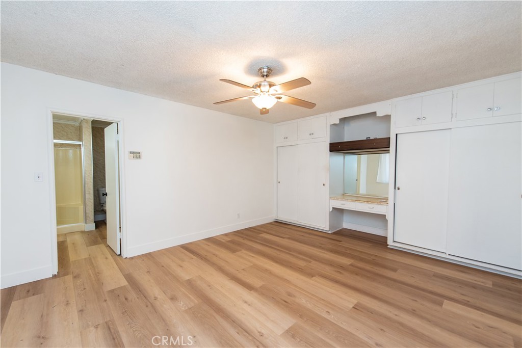 1112 Steele Drive Brea, CA 92821 - Photo 18 of 34 a view of empty room with wooden floor and ceiling fan