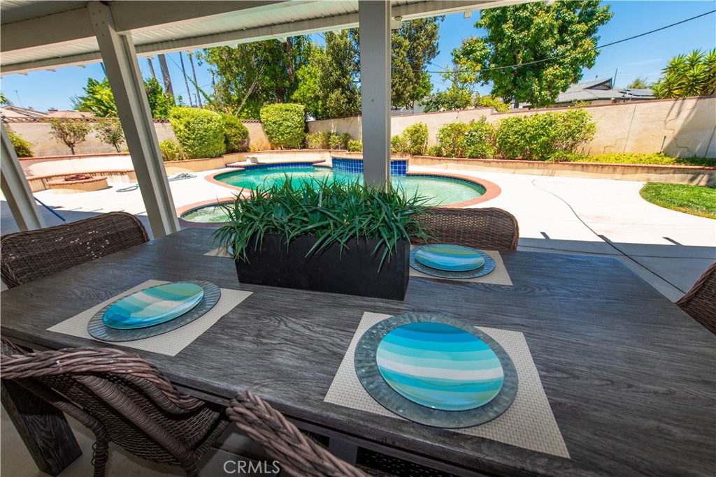 1112 Steele Drive Brea, CA 92821 - Photo 25 of 34 a dining room with furniture and a floor to ceiling window