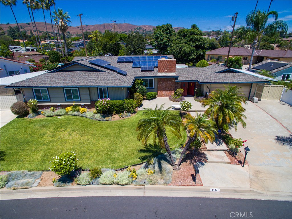 1112 Steele Drive Brea, CA 92821 - Photo 32 of 34 a view of a patio with table and chairs potted plants