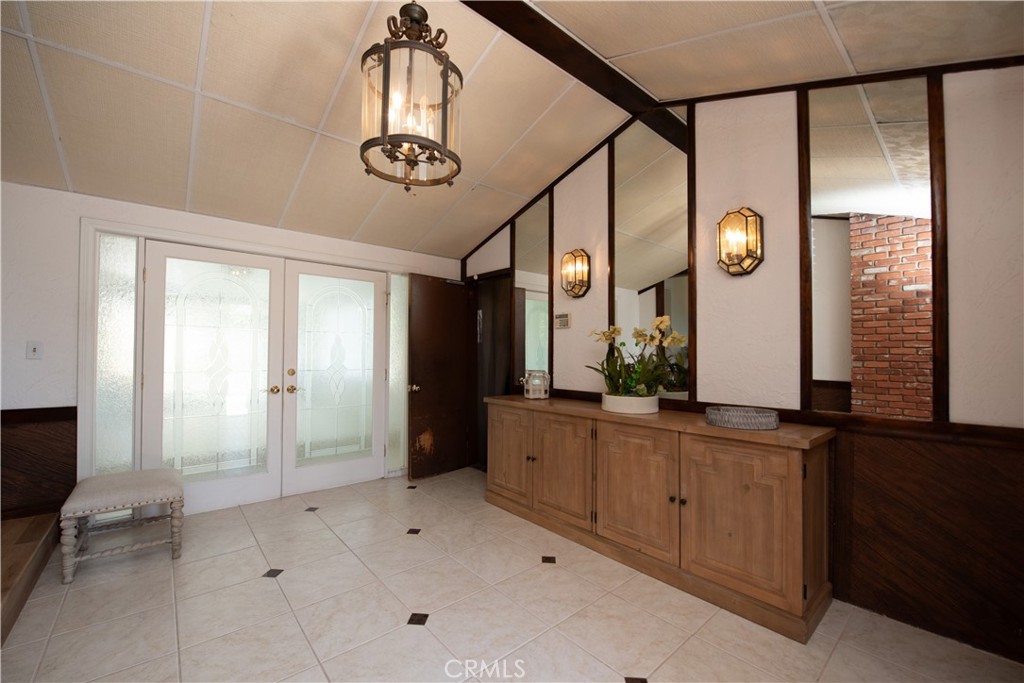 1112 Steele Drive Brea, CA 92821 - Photo 4 of 34 a view of a bathroom with a granite countertop sink a mirror and a shower