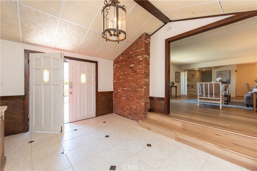 1112 Steele Drive Brea, CA 92821 - Photo 5 of 34 a view of a hallway with wooden floor and chandelier
