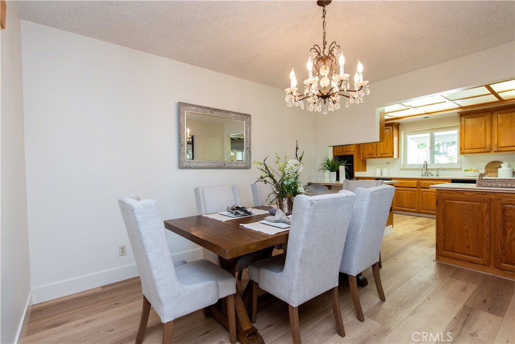 1112 Steele Drive Brea, CA 92821 - Photo 8 of 34 a view of a dining room with furniture and a chandelier