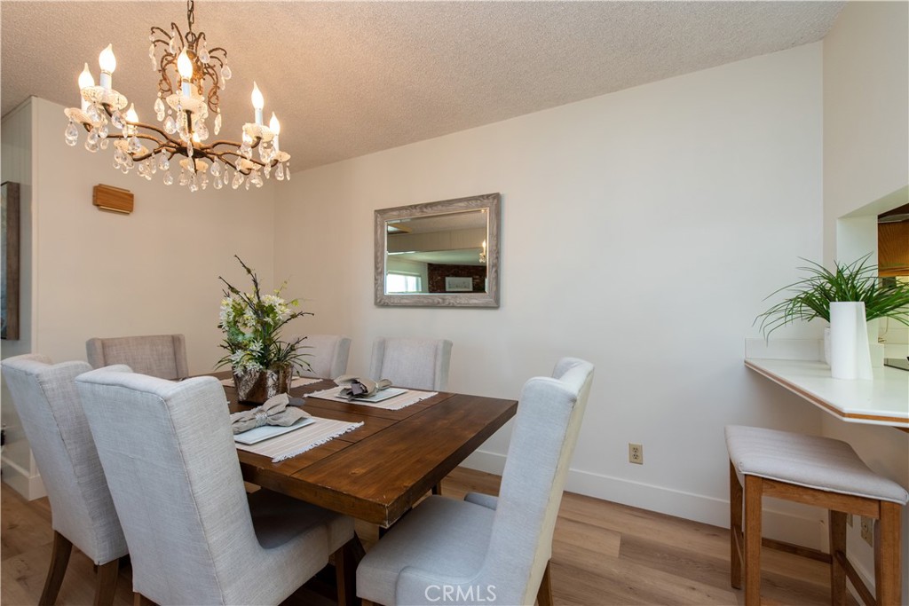 1112 Steele Drive Brea, CA 92821 - Photo 9 of 34 a view of a dining room with furniture and chandelier